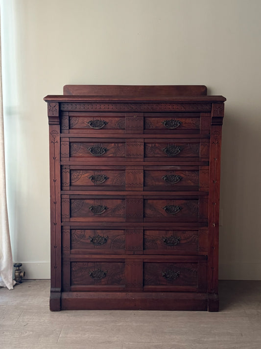Carved Eastlake walnut dresser with side lock