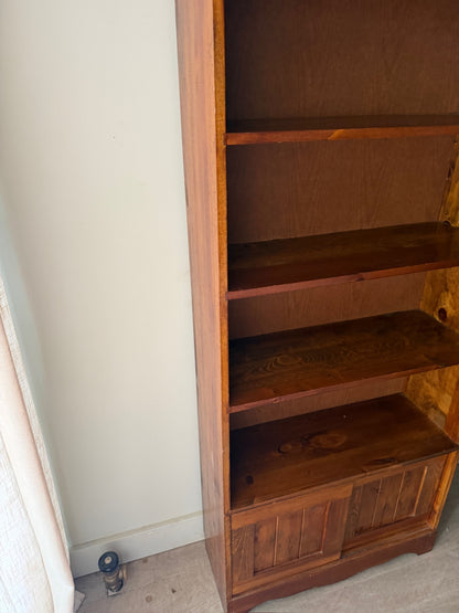 Pine bookcase with sliding doors