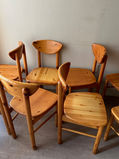 Rainer Daumiller pine cat-eye dining chairs. Sold in sets of 2.