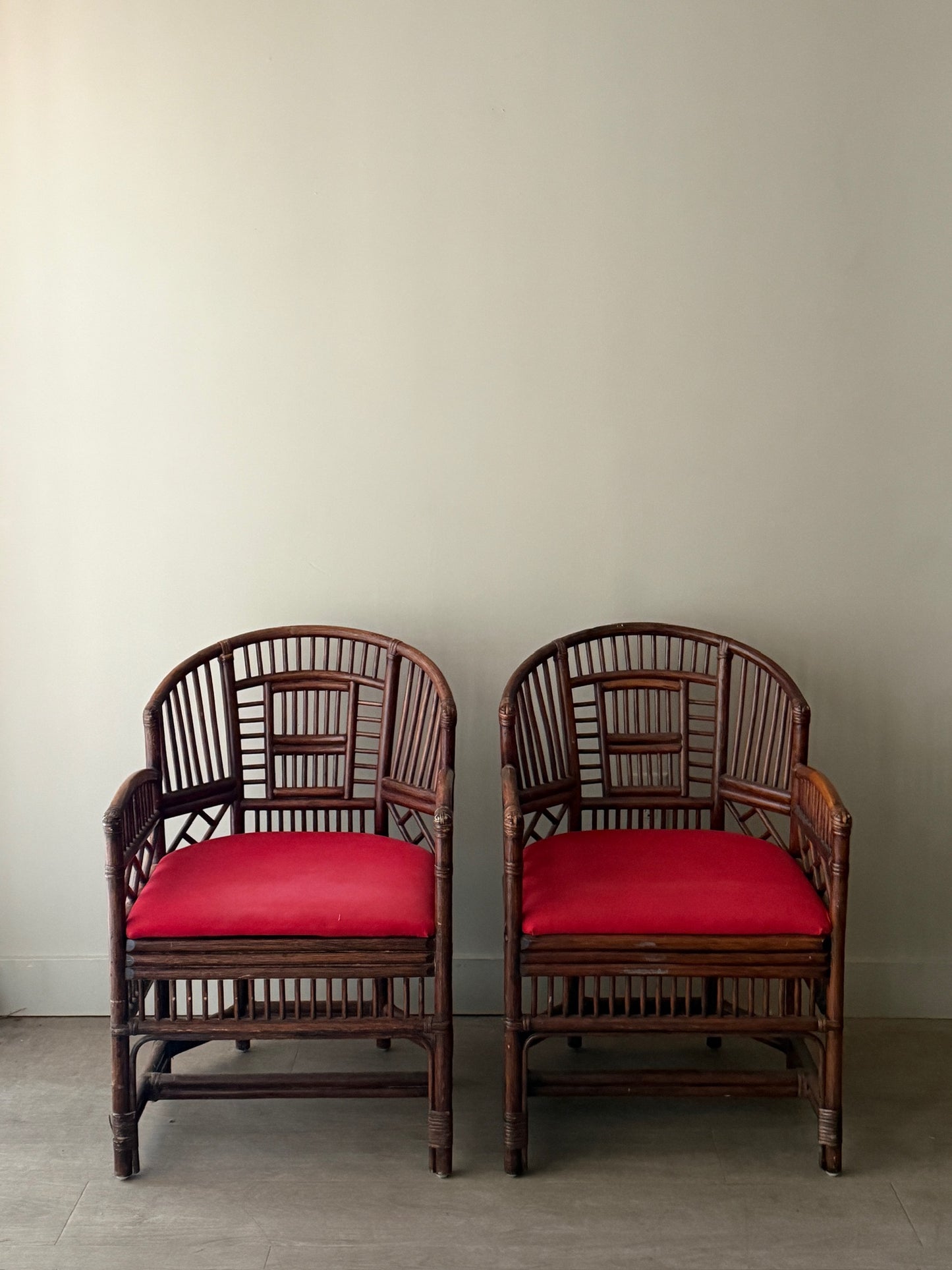 Rattan armchairs. Sold individually.