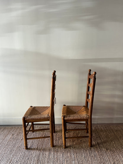 Pair of farmhouse ladder back chairs. Sold as a pair.