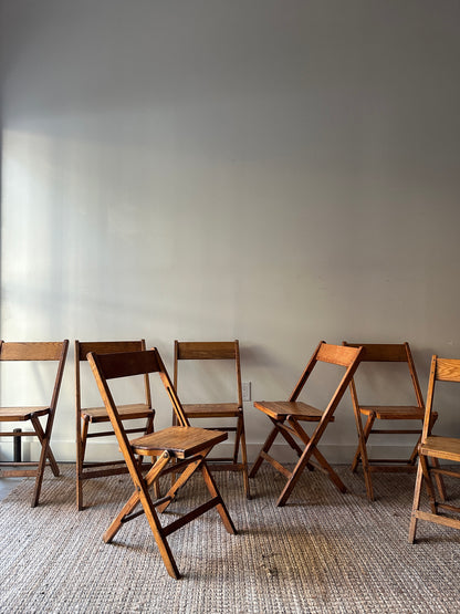 8 oak folding chairs. Sold individually.