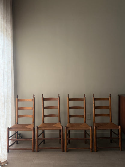 Pine ladder back rush seat chairs. Sold as a set of 4.