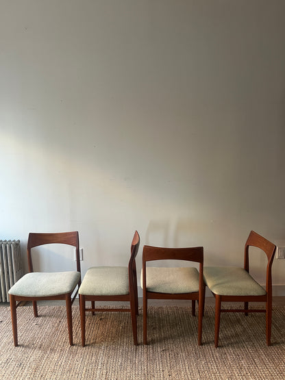 Teak dining chairs. Sold as a set of 4.