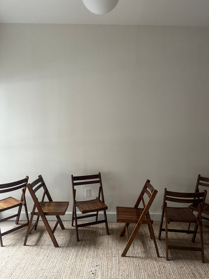 Oak folding chairs. Sold individually.