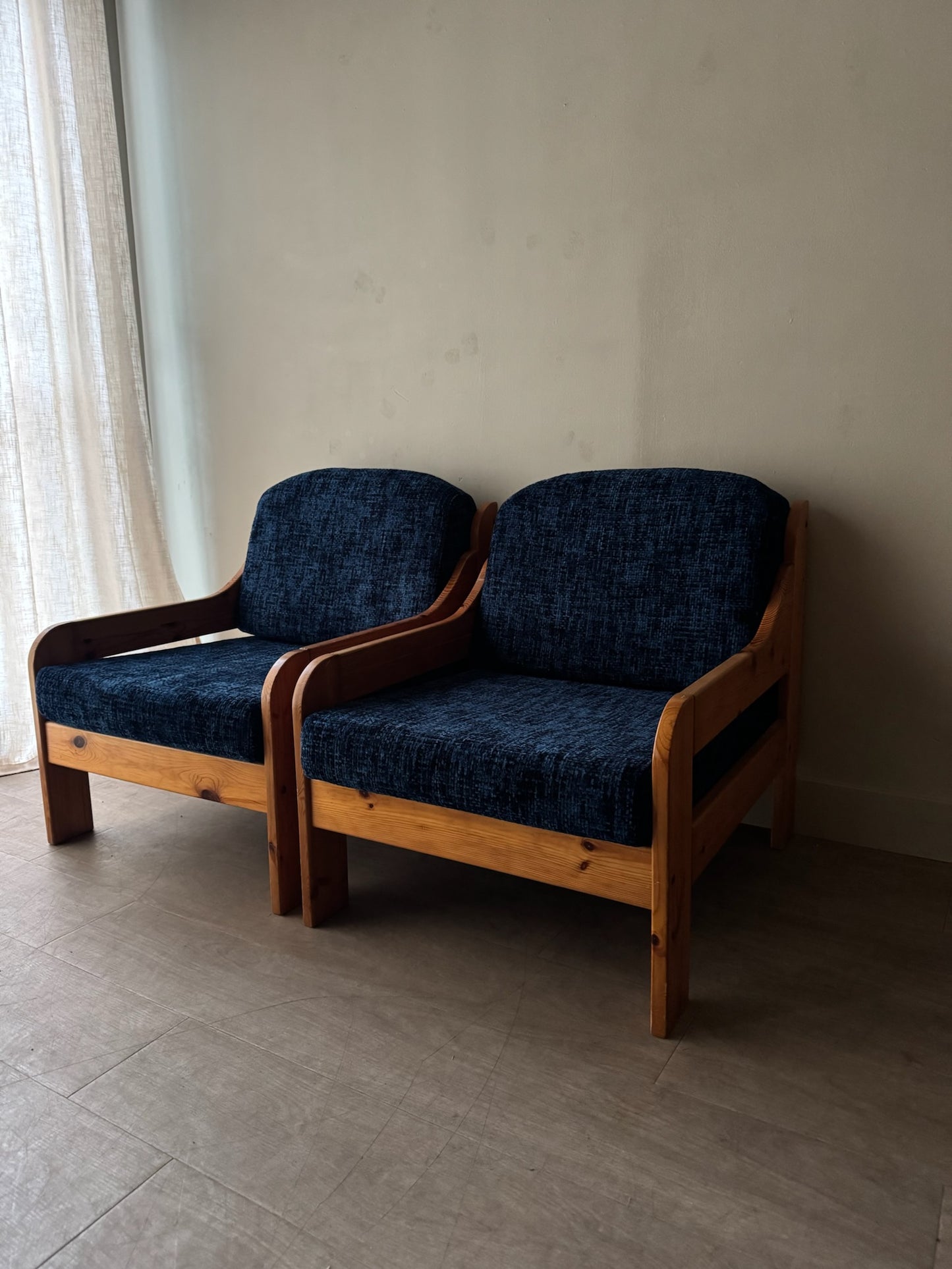 Scandinavian blue upholstered pine lounge chairs. Sold individually.