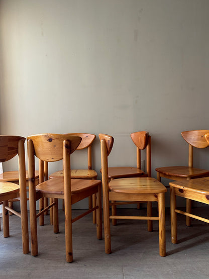 Rainer Daumiller pine cat-eye dining chairs. Sold in sets of 2.