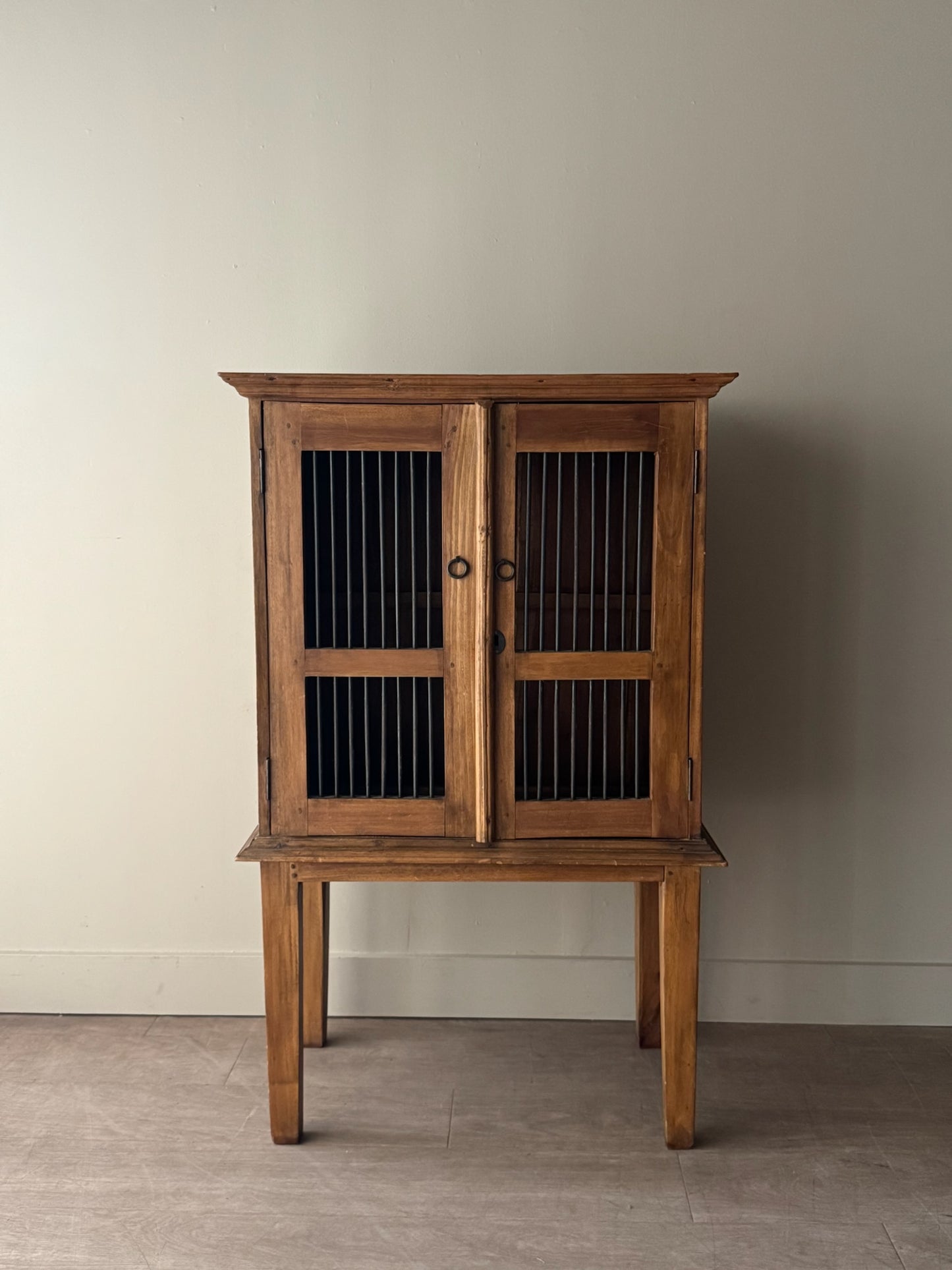 Walnut spindle door cabinet