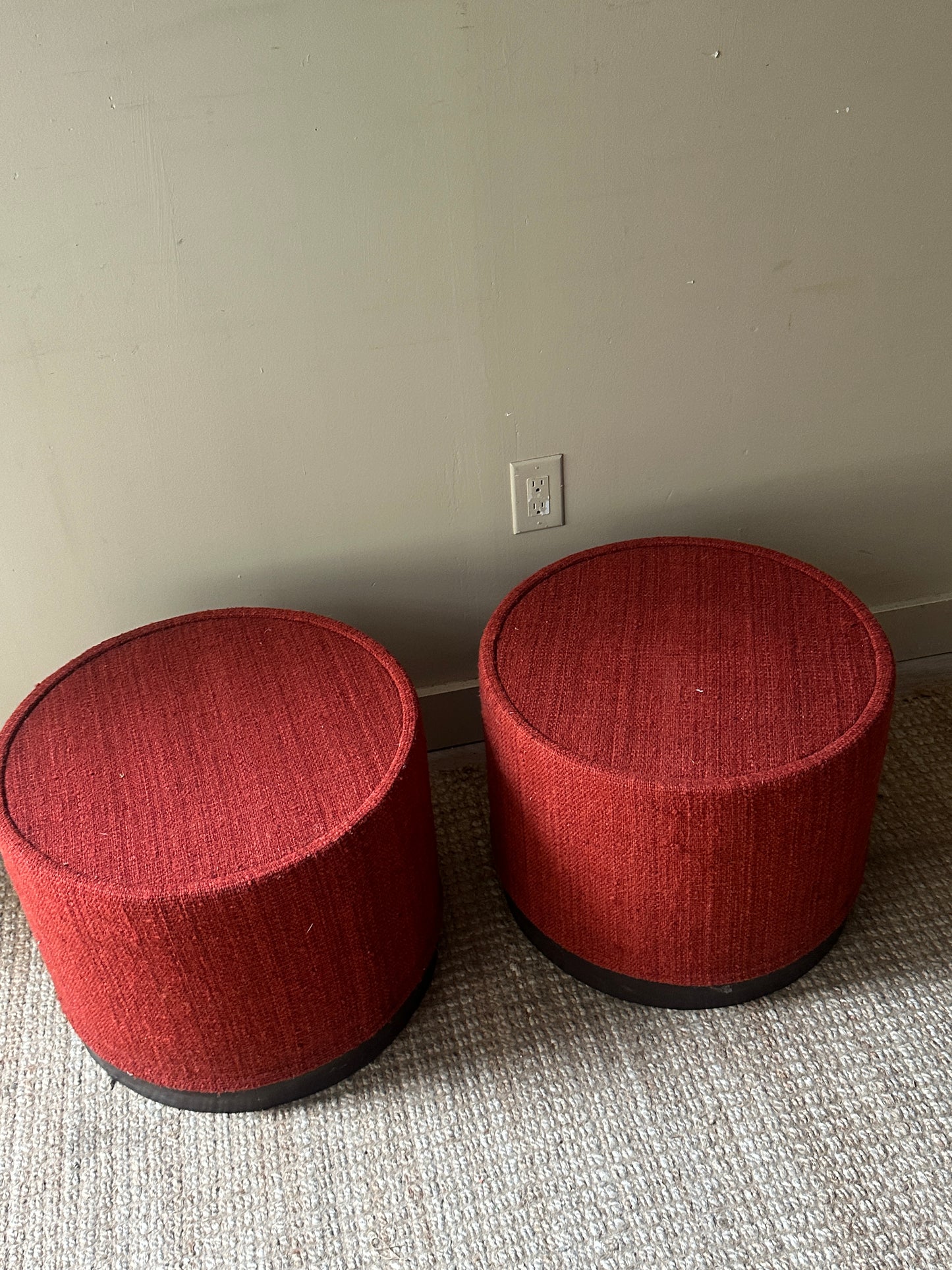 Red wool ottomans. Sold individually.