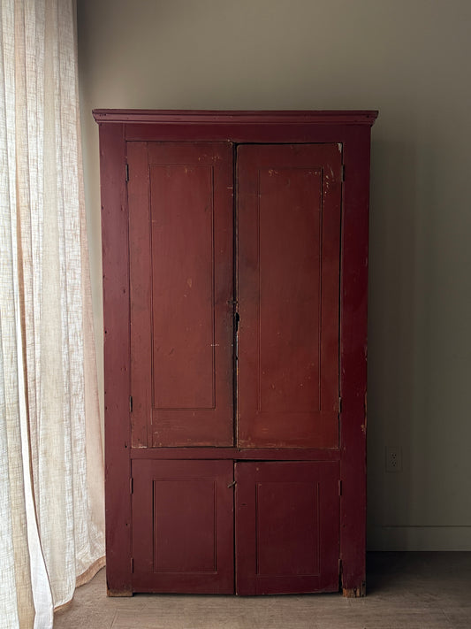Red painted farmhouse cupboard