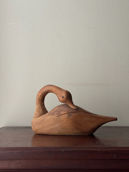 Carved pine swan sculpture
