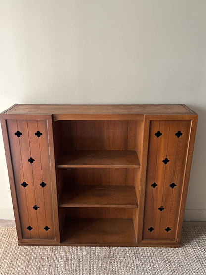 Walnut bookcase with cutouts