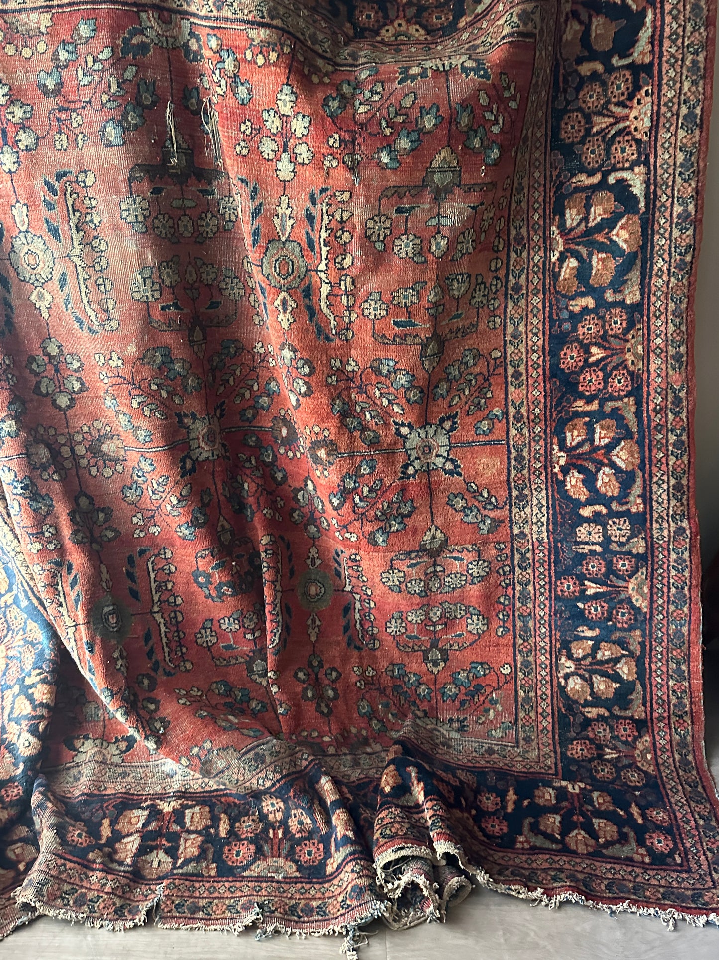 Large rug with some rips