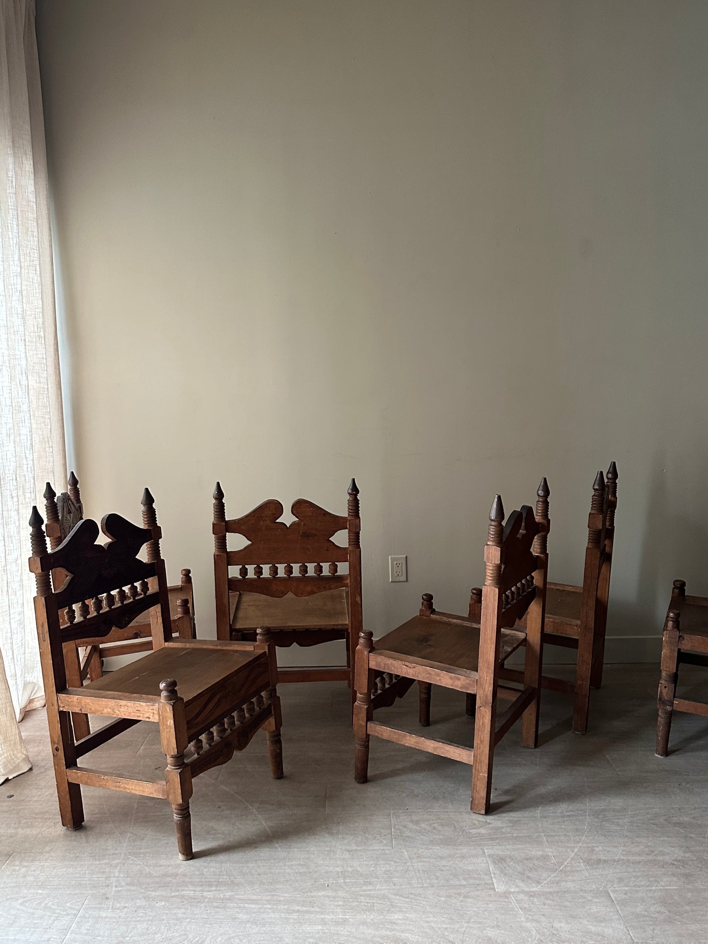 6 hand carved chairs. Sold individually.
