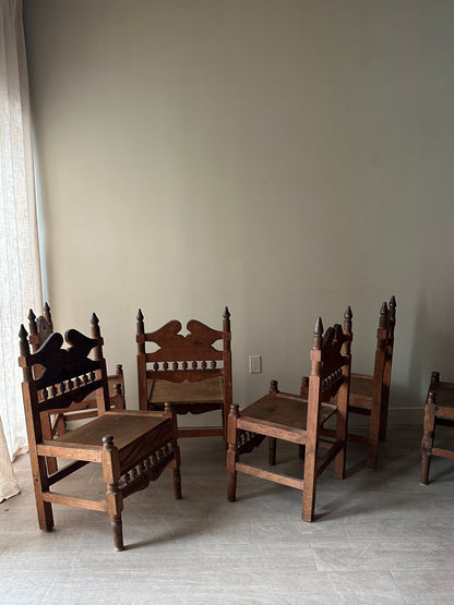 6 hand carved chairs. Sold individually.