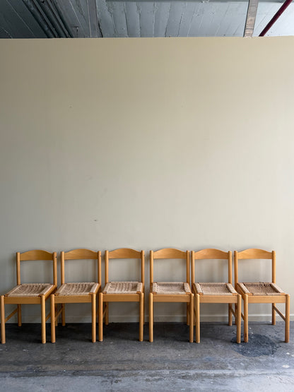Maple dining chairs with twisted rope seats. Sold in pairs.