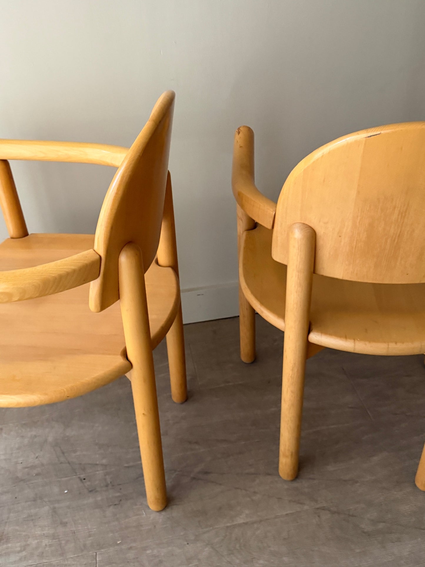 Rainer Daumiller pine dining chairs with arms. Sold individually.