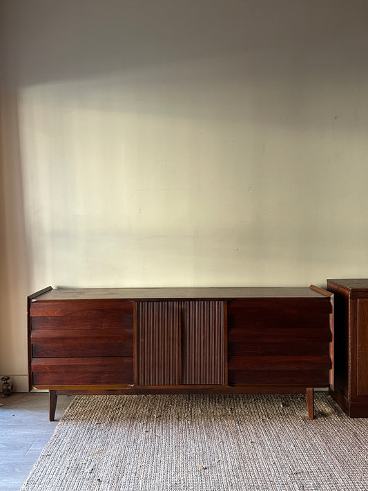 Walnut credenza with fluted doors