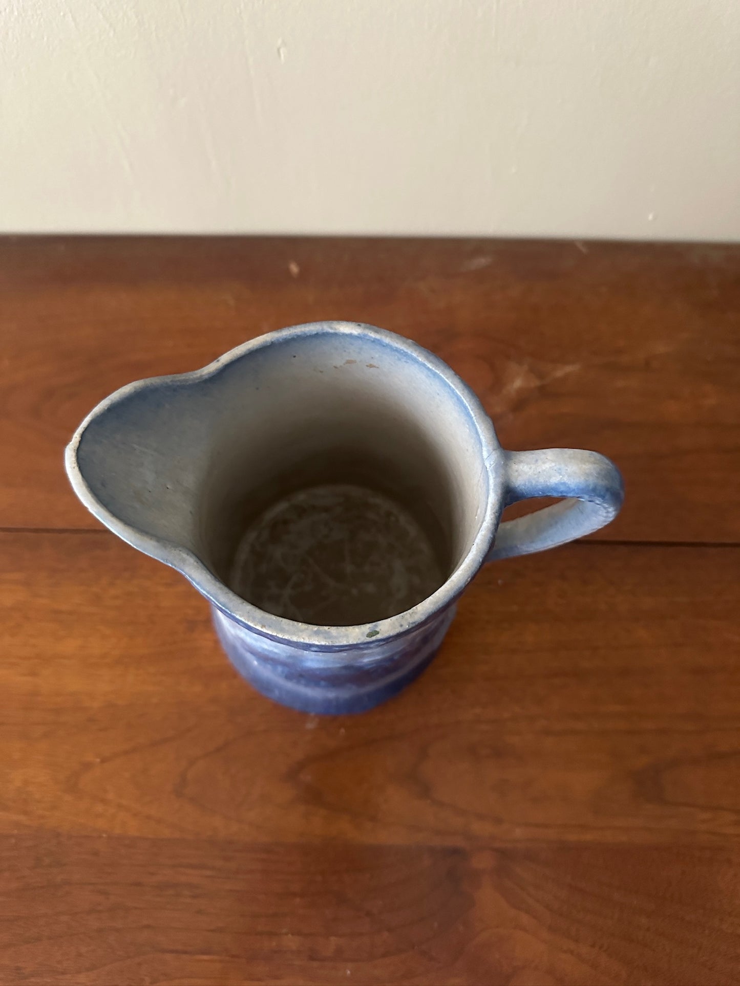 Salt glazed stoneware pitcher with birds and flowers
