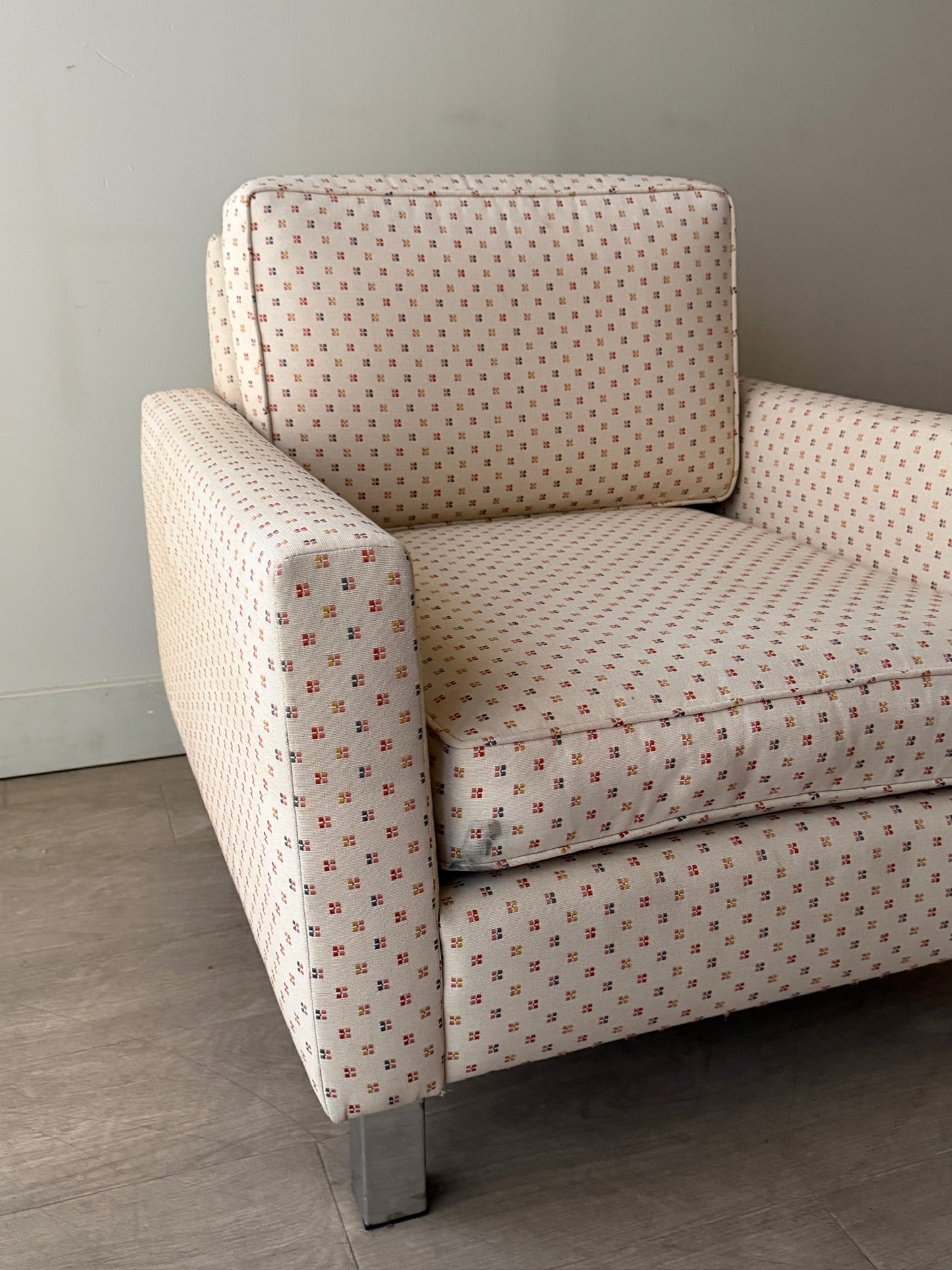 Upholstered chrome armchair