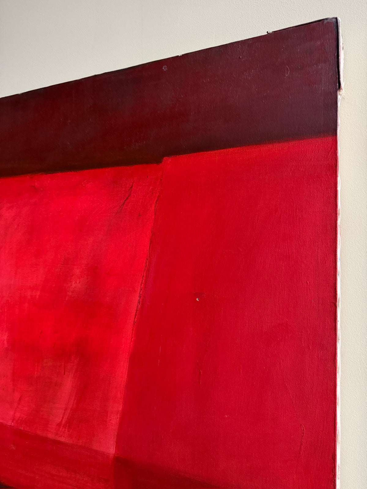 Large red abstract. Signed “Caycedo.”