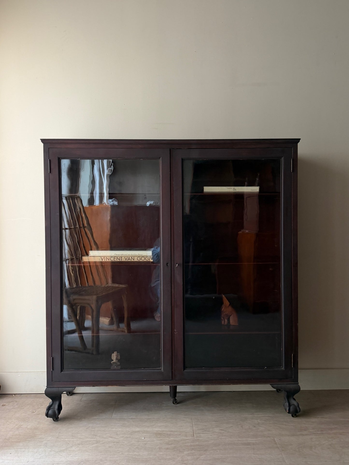 Mahogany claw foot display cabinet