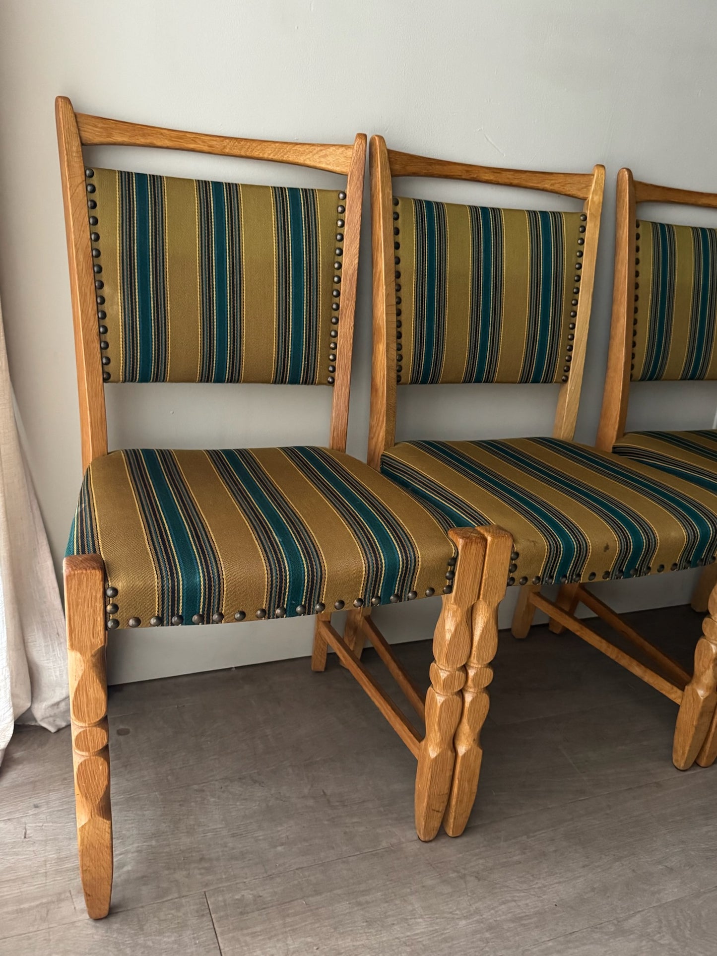 Danish oak dining chairs with striped upholstery. Sold in pairs.