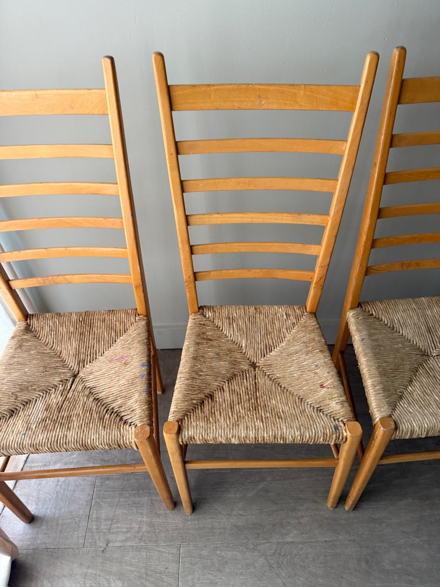 Maple ladder back dining chairs with rush seats. Sold in pairs.