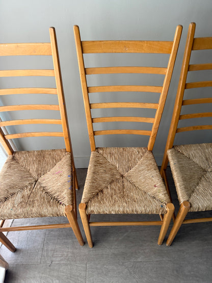 Maple ladder back dining chairs with rush seats. Sold in pairs.