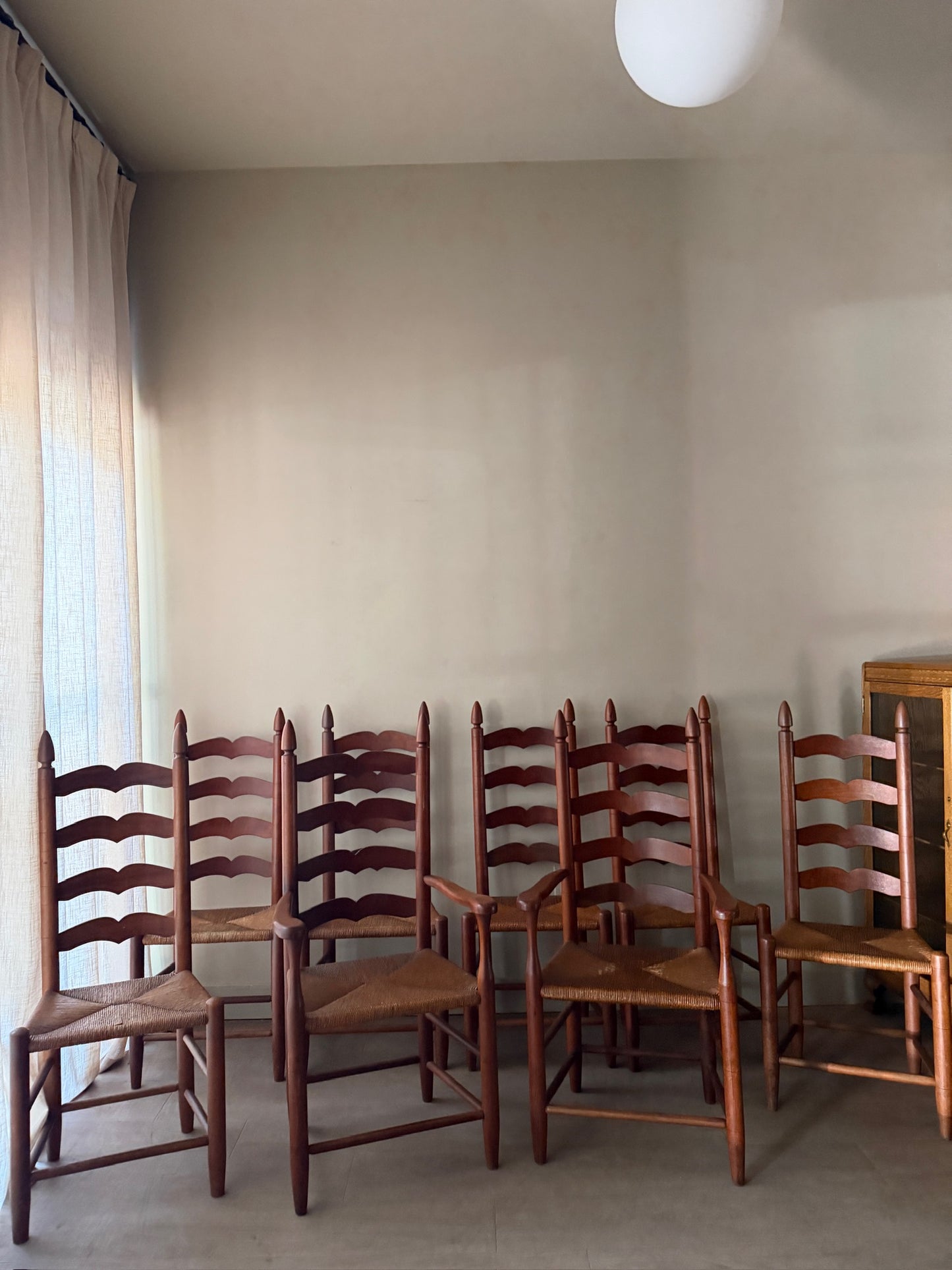 Cherry ladder back rush seat dining chairs. Sold in pairs.
