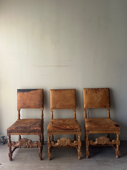 Leather and oak dining chairs. Sold individually.