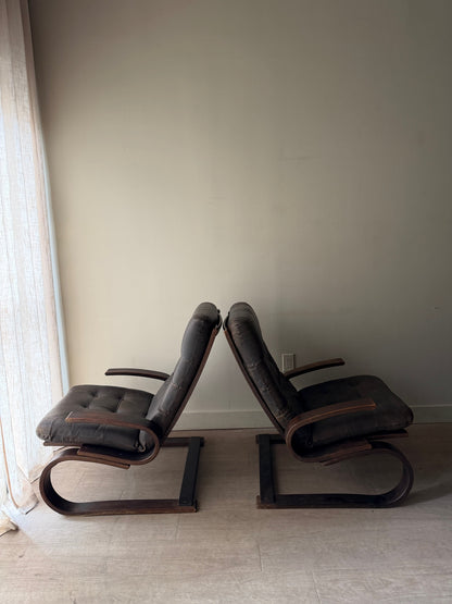 Danish beech bentwood and leather lounge chairs. Sold individually.
