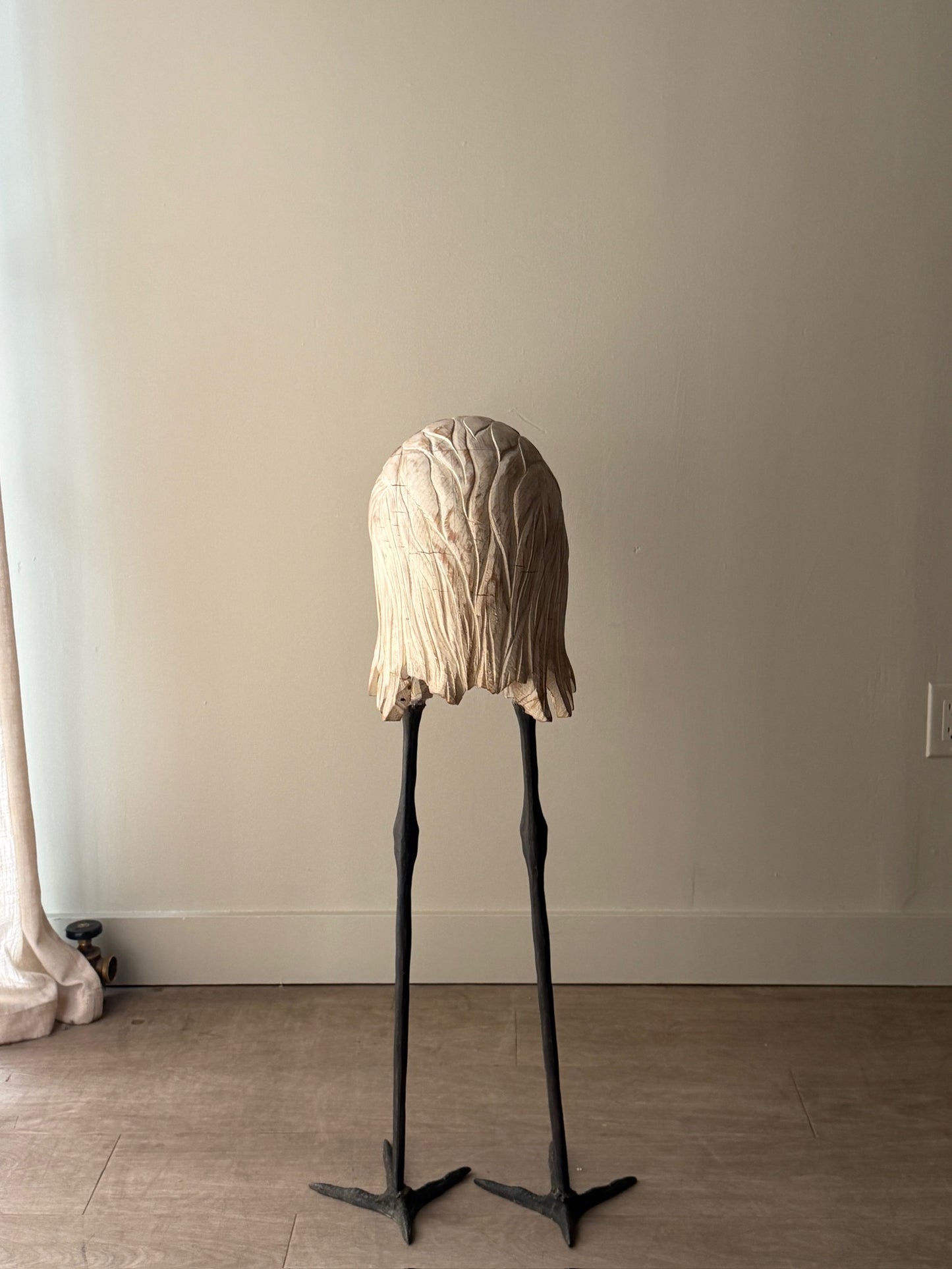 Wooden carved egret statue with iron legs
