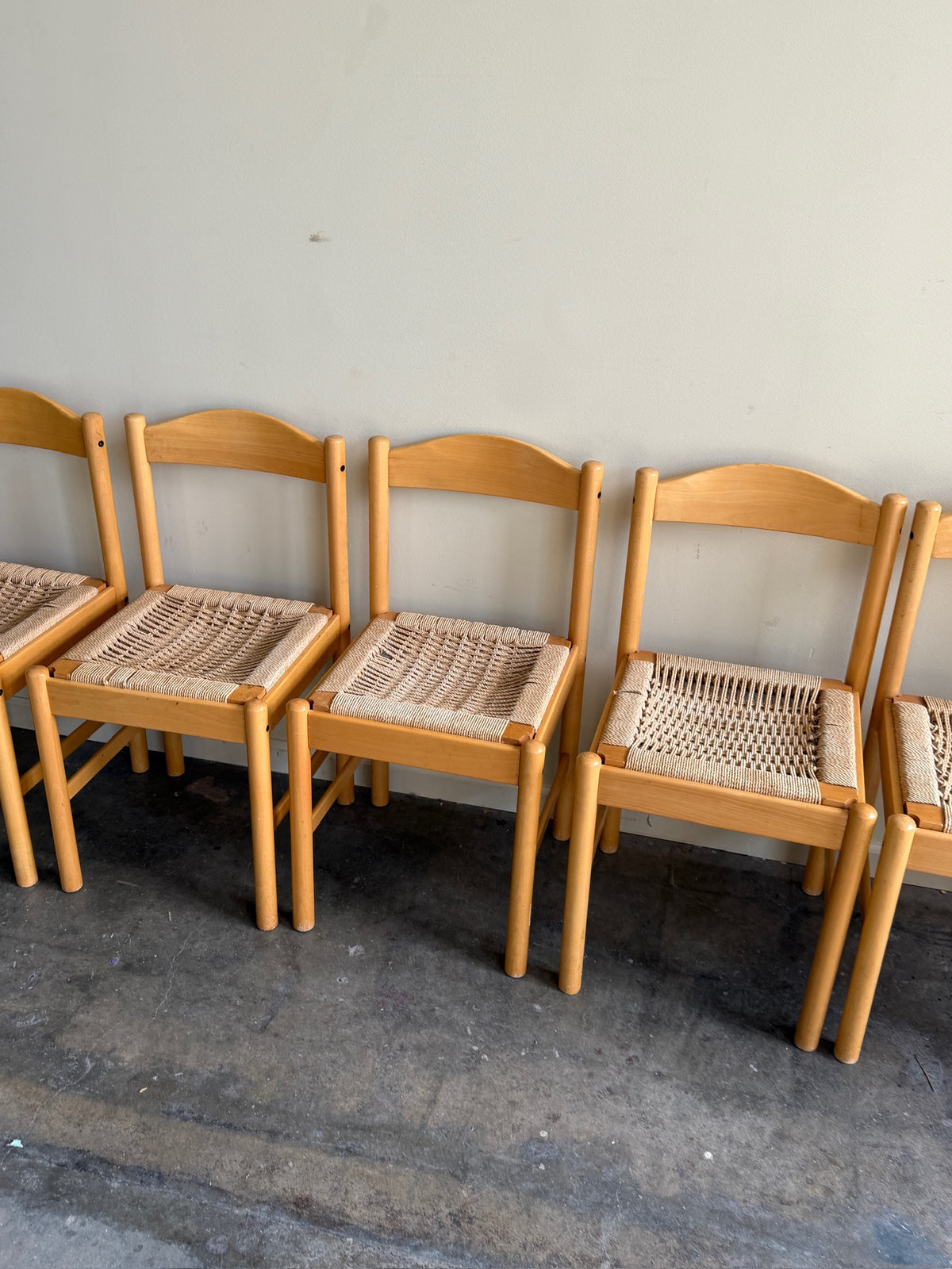 Maple dining chairs with twisted rope seats. Sold in pairs.