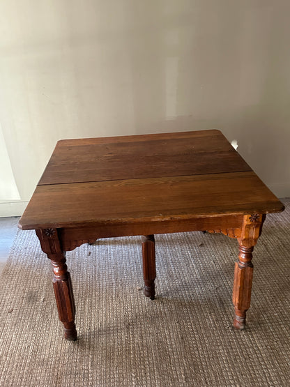 Oak carved dining table with leaf