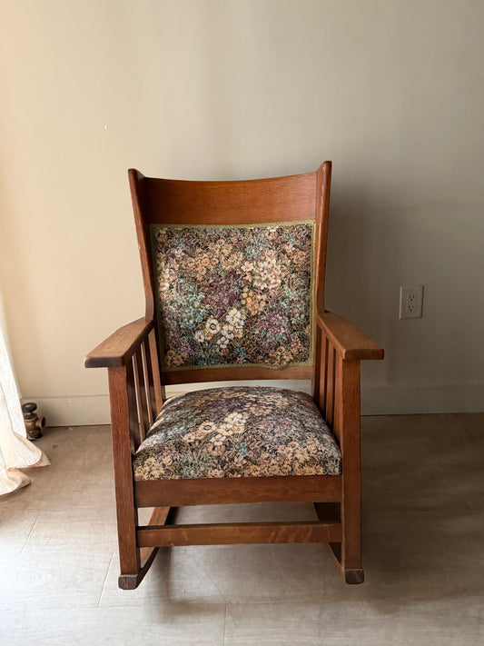 Upholstered golden oak rocking chair