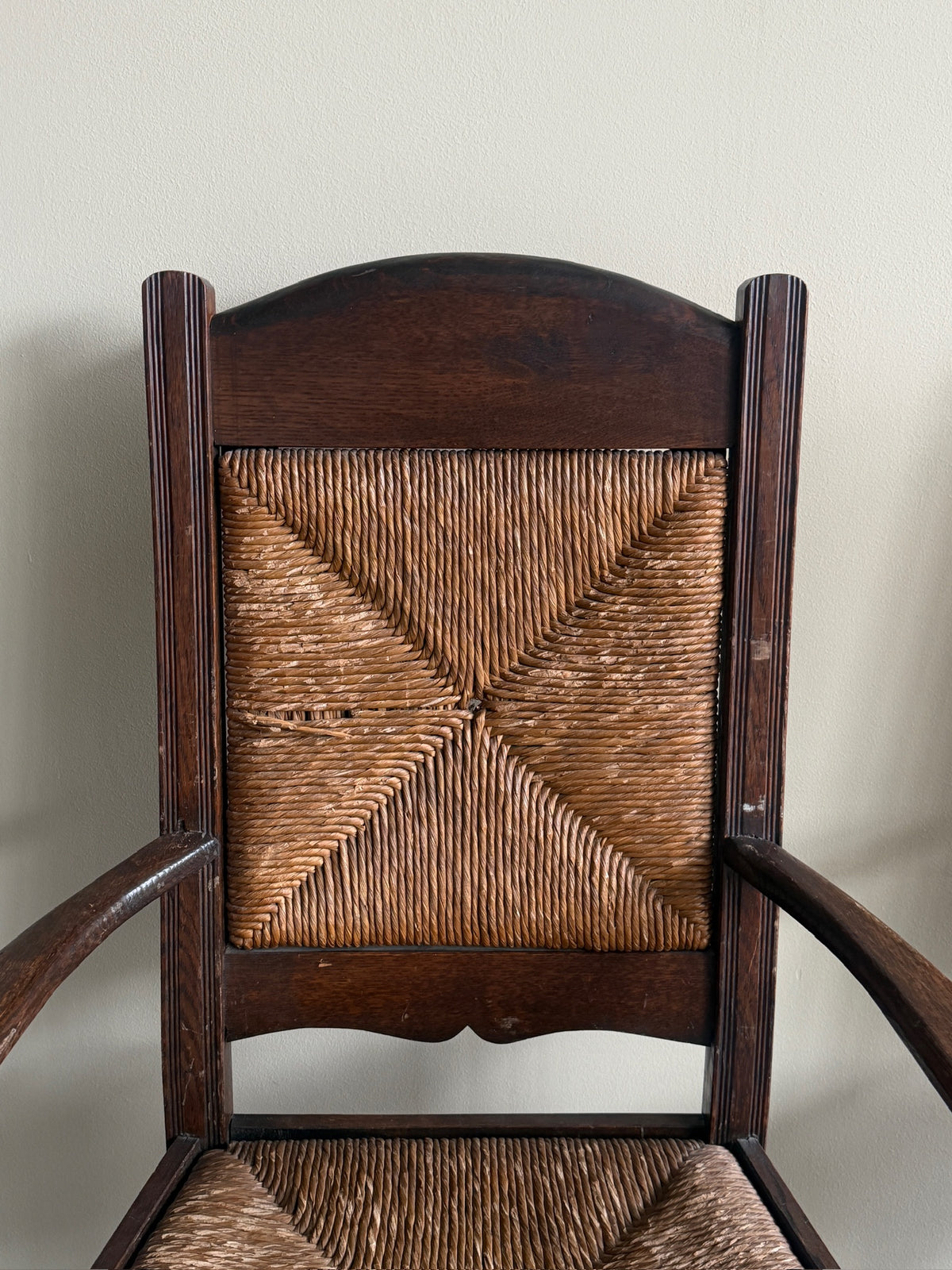English provincial oak & rush armchairs. Sold individually.