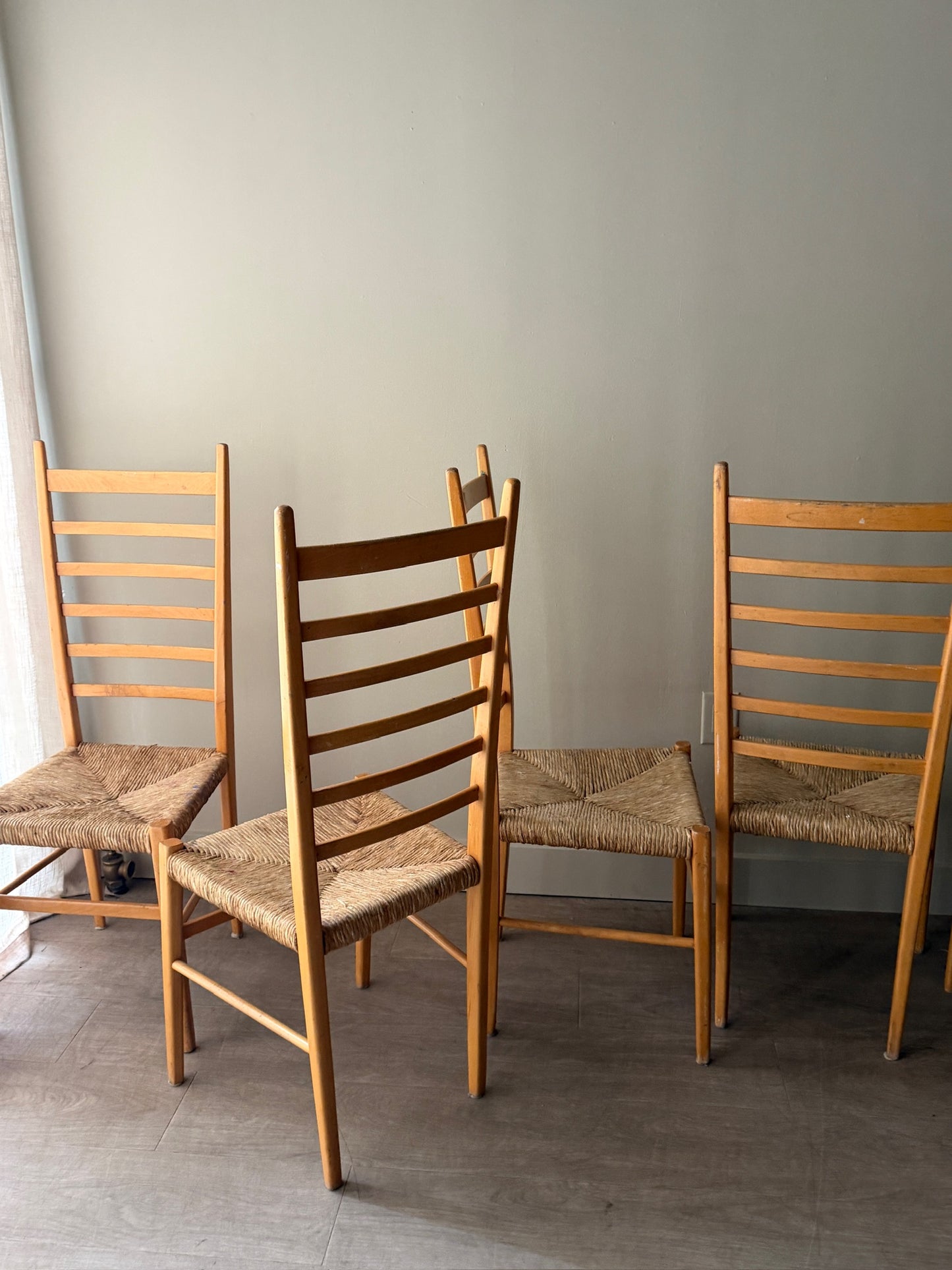Maple ladder back dining chairs with rush seats. Sold in pairs.