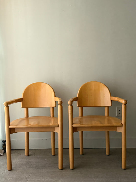 Rainer Daumiller pine dining chairs with arms. Sold individually.