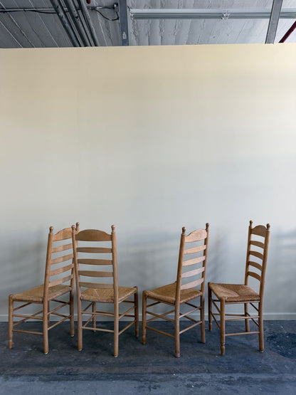 Beech ladder back rush seat dining chairs. Sold in pairs.