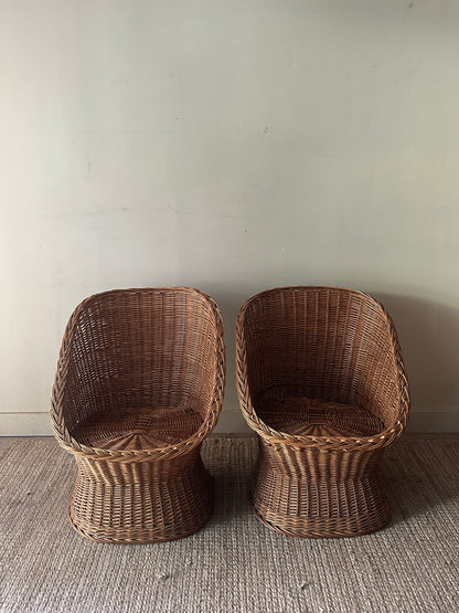Wicker lounge chairs. Sold individually.