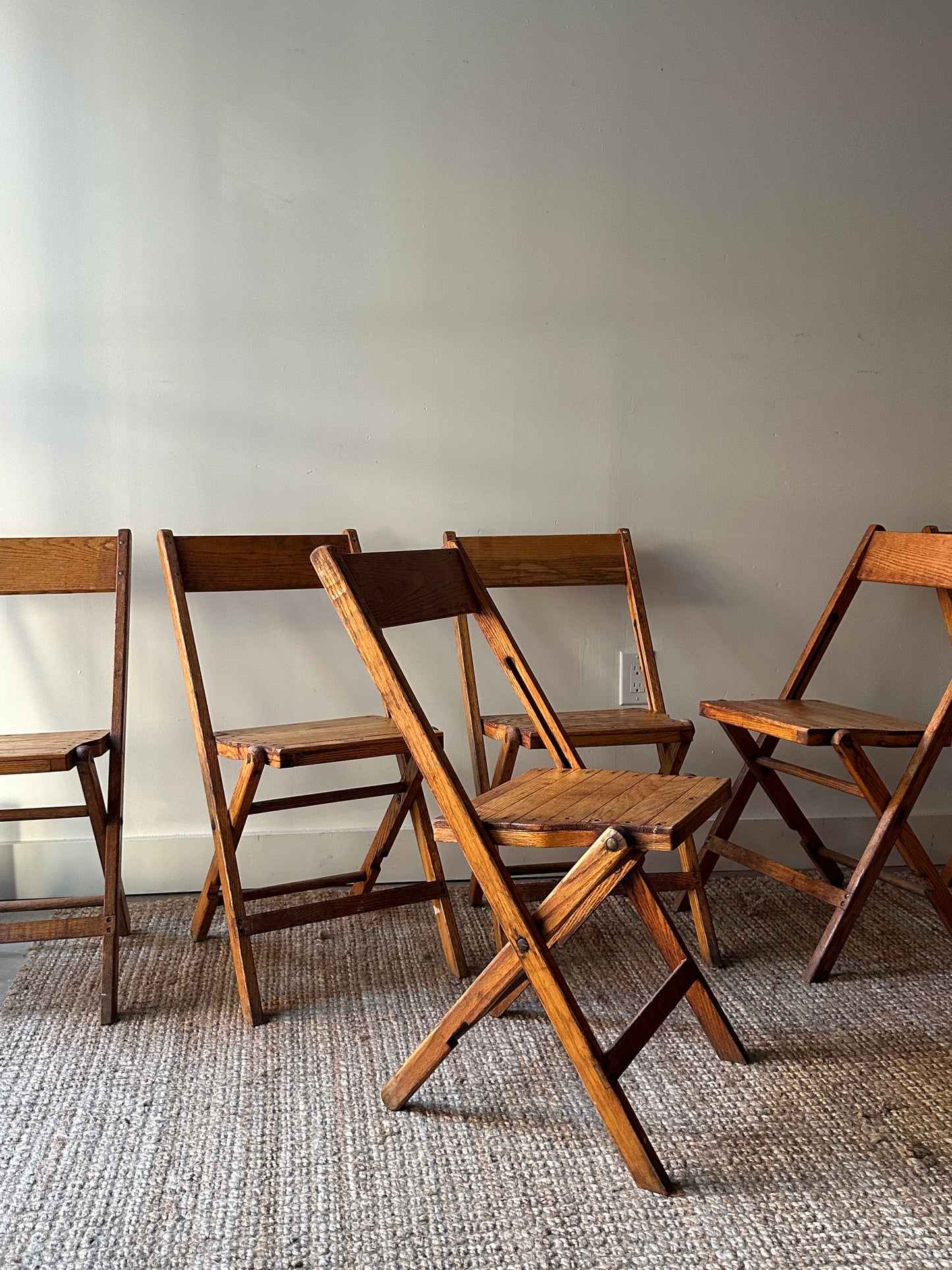 8 oak folding chairs. Sold individually.