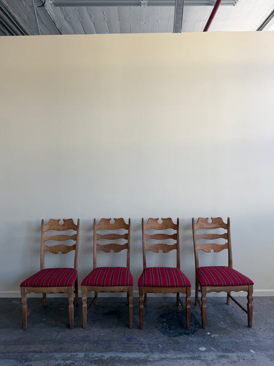 Henning Kjaernulf Danish oak upholstered dining chairs. Sold as a set of 4.