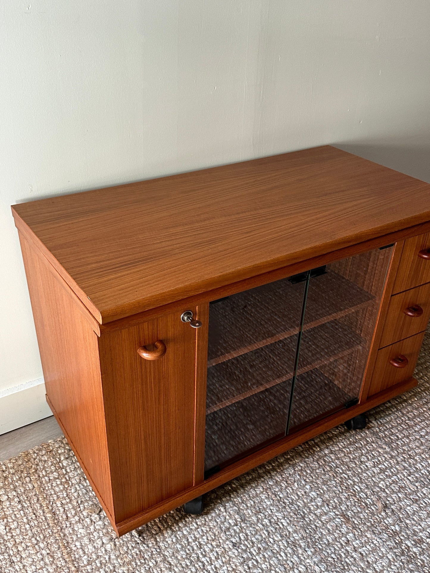 Teak swivel top media cabinet