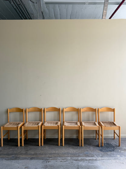 Maple dining chairs with twisted rope seats. Sold in pairs.