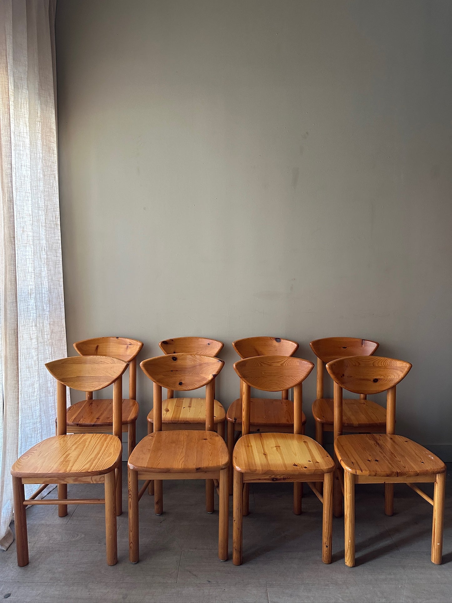 Rainer Daumiller pine cat-eye dining chairs. Sold in sets of 2.