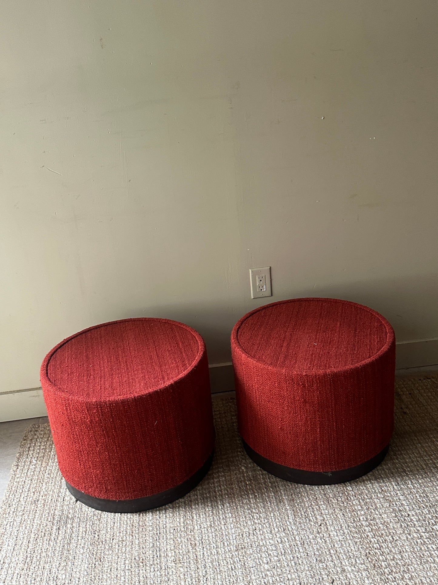 Red wool ottomans. Sold individually.