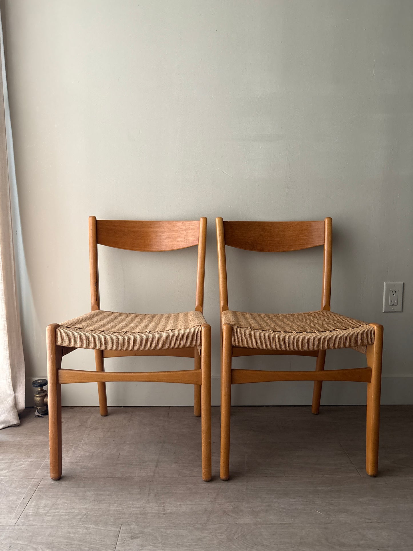 Swedish teak twisted rope seat dining chairs. Sold as a pair.