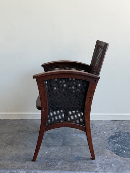 Golden oak caned armchair