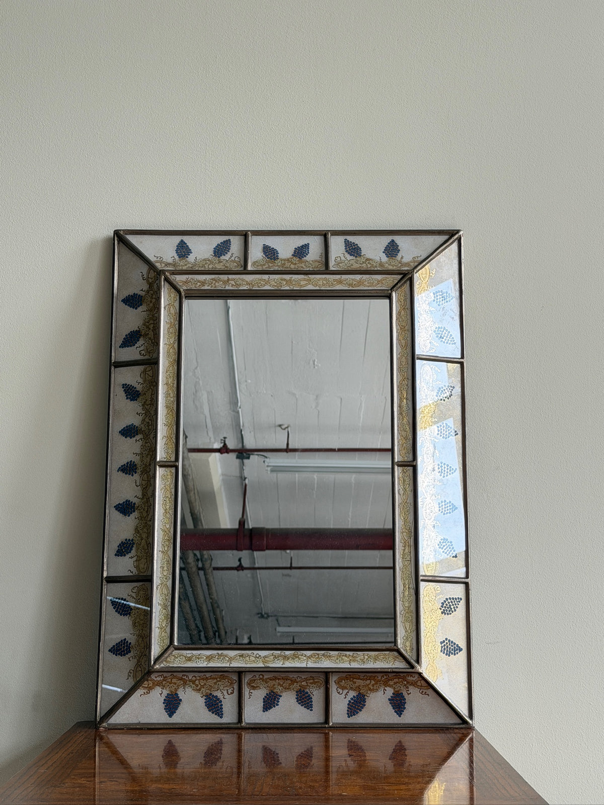 Reverse painted glass mirror